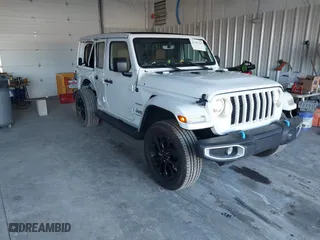 2023 Jeep Wrangler 4xe Sahara with VIN 1C4JJXP69PW513663, listed as a IAAI auction lot 41303342 with 45,892 mi miles. Bid and sale history available at carsss.com. Image 1.