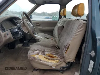 1994 Toyota T100 DX with VIN JT4VD10A6R0017701, listed as a Copart auction lot 46034975 with 219,651 mi miles and Salvage Title. Bid and sale history available at DreamBid. Image 7.