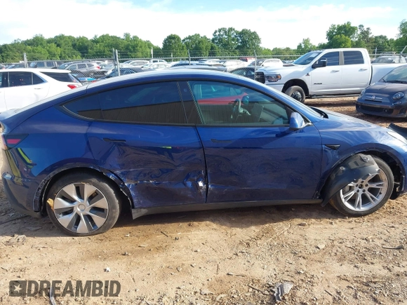 2022 Tesla Model Y Long Range z VIN 7SAYGDEE0NF429399, wystawiony jako IAAI lot #42333630 z przebiegiem 32 937 mil mil oraz . Historia ofert i sprzedaży dostępna na DreamBid. Obrazek 13.