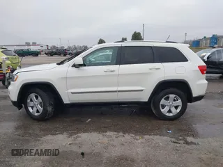 2012 Jeep Grand Cherokee Laredo with VIN 1C4RJFAG6CC297958, listed as a IAAI auction lot 40859811 with 213,499 mi miles. Bid and sale history available at carsss.com. Image 14.