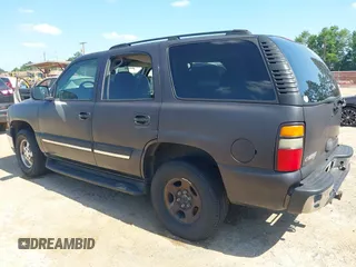 2004 Chevrolet Tahoe LS z VIN 1GNEC13V74R295259, wystawiony jako IAAI lot #42339839 z przebiegiem 264 778 mil mil oraz . Historia ofert i sprzedaży dostępna na DreamBid. Obrazek 3.