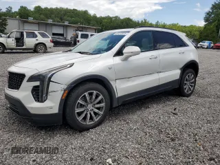 2019 Cadillac XT4 FWD Sport with VIN 1GYFZER44KF210582, listed as a Copart auction lot 61272015 with 104,073 mi miles and Salvage title. Bid and sale history available at DreamBid. Image 1.