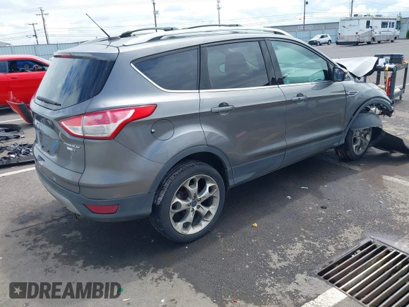 2013 Ford Escape Titanium with VIN 1FMCU9J95DUC95061, listed as a IAAI auction lot 42293047 with 124,641 mi miles and . Bid and sale history available at DreamBid. Image 4.