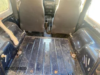 2003 Jeep Wrangler SE with VIN 1J4FA29143P371506, listed as a Copart auction lot 80153184 with 101,513 mi miles and Clean title. Bid and sale history available at DreamBid. Image 6.