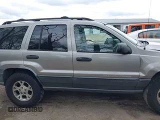 2001 Jeep Grand Cherokee Laredo z VIN 1J4GW48S01C658017, wystawiony jako IAAI lot #42160310 z przebiegiem 220 309 mil mil oraz . Historia ofert i sprzedaży dostępna na DreamBid. Obrazek 14.