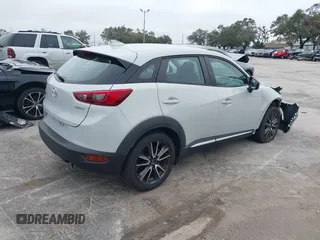 2016 Mazda CX-3 Grand Touring with VIN JM1DKDD72G0128891, listed as a IAAI auction lot 41401456 with 60,911 mi miles. Bid and sale history available at carsss.com. Image 4.