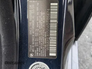 2006 BMW 7 Series 750i with VIN WBAHL83506DT05674, listed as a Copart auction lot 77176834 with 263,495 mi miles and Salvage title. Bid and sale history available at DreamBid. Image 12.