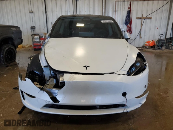 2023 Tesla Model Y Long Range z VIN 7SAYGAEE5PF672546, wystawiony jako Copart lot #42779065 z przebiegiem 27 570 mil mil oraz Nie do naprawy • Non repairable. Historia ofert i sprzedaży dostępna na DreamBid. Obrazek 5.
