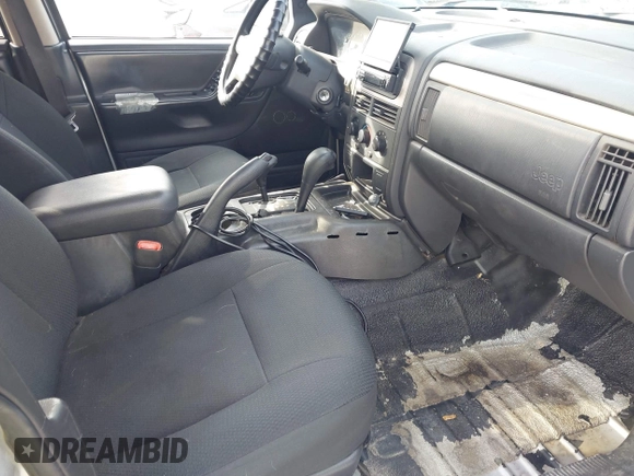 2003 Jeep Grand Cherokee Laredo z VIN 1J8GW48S33C519680, wystawiony jako IAAI lot #42126714 z przebiegiem 295 517 mil mil oraz . Historia ofert i sprzedaży dostępna na DreamBid. Obrazek 5.