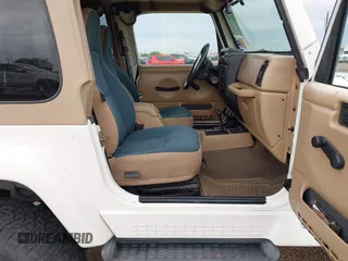 2001 Jeep Wrangler Sahara with VIN 1J4FA59S71P365271, listed as a IAAI auction lot 41889948 with 144,357 mi miles. Bid and sale history available at carsss.com. Image 5.