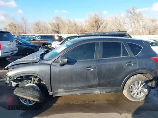 2016 Mazda CX-5 Touring with VIN JM3KE4CY0G0751040, listed as a IAAI auction lot 41290780 with 136,689 mi miles. Bid and sale history available at carsss.com. Image 15.