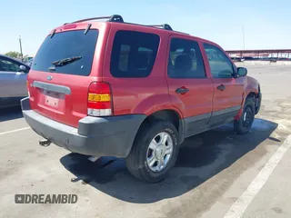 2003 Ford Escape XLT Popular 2 with VIN 1FMYU93123KB02310, listed as a IAAI auction lot 41975073 with 169,864 mi miles. Bid and sale history available at carsss.com. Image 4.