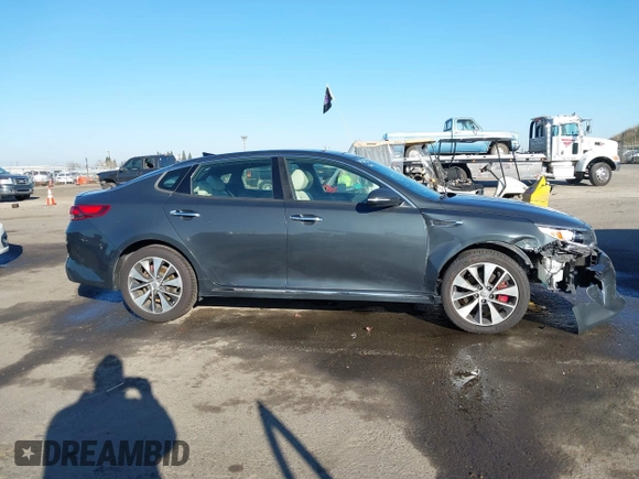 2016 Kia Optima SXL Turbo with VIN 5XXGV4L2XGG051938, listed as a IAAI auction lot 41400484 with 114,722 mi miles. Bid and sale history available at carsss.com. Image 13.