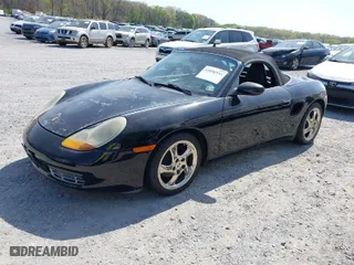 1999 Porsche Boxster with VIN WP0CA2980XU624284, listed as a IAAI auction lot 42058935 with 79,497 mi miles. Bid and sale history available at carsss.com. Image 2.