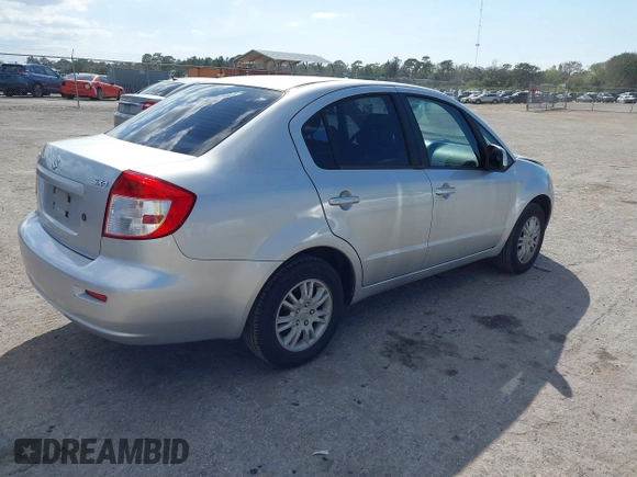 2012 Suzuki SX4 LE with VIN JS2YC5A30C6304324, listed as a IAAI auction lot 41585174 with 111,471 mi miles. Bid and sale history available at carsss.com. Image 4.