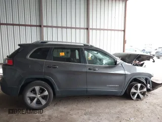 2020 Jeep Cherokee Limited z VIN 1C4PJLDBXLD587216, wystawiony jako IAAI lot #41941781 z przebiegiem Nie podano mil oraz . Historia ofert i sprzedaży dostępna na DreamBid. Obrazek 13.