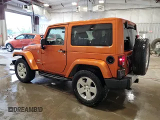 2011 Jeep Wrangler Sahara with VIN 1J4GA5D1XBL557392, listed as a Copart auction lot 56892835 with 109,567 mi miles and Clean title. Bid and sale history available at DreamBid. Image 2.