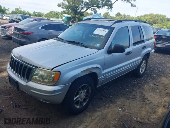 2002 Jeep Grand Cherokee Laredo z VIN 1J4GW48S62C261154, wystawiony jako IAAI lot #42602424 z przebiegiem 160 295 mil mil oraz . Historia ofert i sprzedaży dostępna na DreamBid. Obrazek 2.