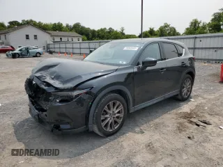 2019 Mazda CX-5 Grand Touring with VIN JM3KFBDM2K0569829, listed as a Copart auction lot 59060965 with 99,359 mi miles and Salvage title. Bid and sale history available at DreamBid. Image 1.
