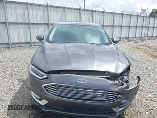 2017 Ford Fusion Titanium with VIN 3FA6P0K98HR363360, listed as a IAAI auction lot 42461432 with 182,807 mi miles and . Bid and sale history available at DreamBid. Image 12.