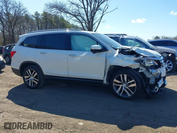 2017 Honda Pilot Touring z VIN 5FNYF6H99HB089121, wystawiony jako IAAI lot #41896878 z przebiegiem 145 330 mil mil oraz . Historia ofert i sprzedaży dostępna na DreamBid. Obrazek 13.