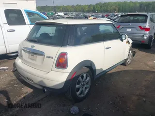 2007 MINI Hardtop with VIN WMWMF33587TT52466, listed as a IAAI auction lot 41964371 with 129,842 mi miles and . Bid and sale history available at DreamBid. Image 4.