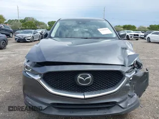2021 Mazda CX-5 Touring with VIN JM3KFACM1M0461510, listed as a IAAI auction lot 41660439 with 30,352 mi miles. Bid and sale history available at carsss.com. Image 6.