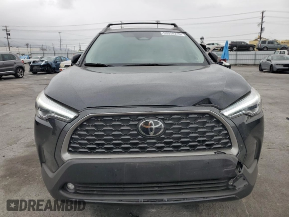 2024 Toyota Corolla Cross XLE with VIN 7MUDAAAG8RV095021, listed as a Copart auction lot 59232265 with 7,010 mi miles and Salvage title. Bid and sale history available at DreamBid. Image 5.
