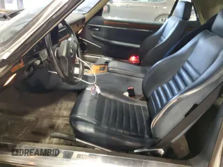 1989 Jaguar XJS z VIN SAJNV4847KC164497, wystawiony jako Copart lot #87258504 z przebiegiem 90 299 mil mil oraz Szkody całkowita. Historia ofert i sprzedaży dostępna na DreamBid. Obrazek 7.