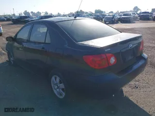 2003 Toyota Corolla CE with VIN 1NXBR32E43Z047677, listed as a IAAI auction lot 41427393 with 299,999 mi miles. Bid and sale history available at carsss.com. Image 3.