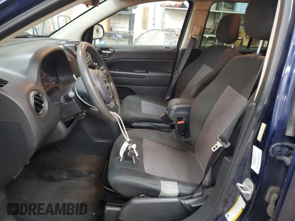 2014 Jeep Compass Sport with VIN 1C4NJDBB0ED598518, listed as a Copart auction lot 55072665 with 128,141 mi miles and Salvage Title. Bid and sale history available at carsss.com. Image 7.
