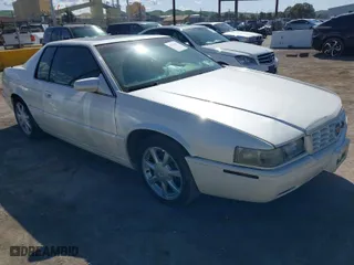 1999 Cadillac Eldorado Touring with VIN 1G6ET1290XU610405, listed as a IAAI auction lot 41967911 with NaN miles. Bid and sale history available at carsss.com. Image 1.