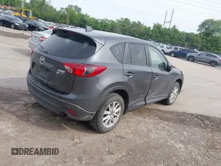 2014 Mazda CX-5 Touring z VIN JM3KE4CY2E0348500, wystawiony jako IAAI lot #42318155 z przebiegiem 182 616 mil mil oraz . Historia ofert i sprzedaży dostępna na DreamBid. Obrazek 4.