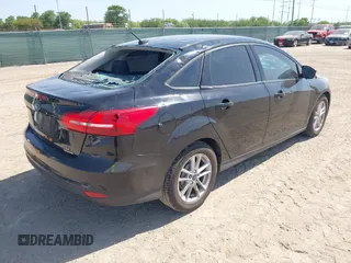 2016 Ford Focus SE with VIN 1FADP3F28GL349817, listed as a IAAI auction lot 42016215 with 68,816 mi miles and . Bid and sale history available at DreamBid. Image 4.