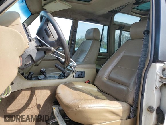 1998 Land Rover Discovery SD z VIN SALJY1246WA781850, wystawiony jako Copart lot #69113644 z przebiegiem 58 468 mil mil oraz Czysty tytuł • Clean title. Historia ofert i sprzedaży dostępna na DreamBid. Obrazek 7.