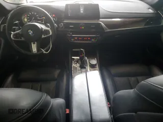 2018 BMW 5 Series M550i xDrive with VIN WBAJB9C58JB035267, listed as a Copart auction lot 64616605 with 125,365 mi miles and Clean title. Bid and sale history available at DreamBid. Image 8.