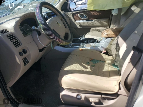 2005 Mercury Mariner Luxury z VIN 4M2CU56125DJ17538, wystawiony jako Copart lot #46948345 z przebiegiem 158 277 mil mil oraz Szkoda całkowita • Salvage title. Historia ofert i sprzedaży dostępna na DreamBid. Obrazek 7.