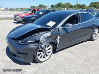 2018 Tesla Model 3 Long Range Battery with VIN 5YJ3E1EB1JF087098, listed as a IAAI auction lot 41737127 with 172,412 mi miles. Bid and sale history available at carsss.com. Image 23.