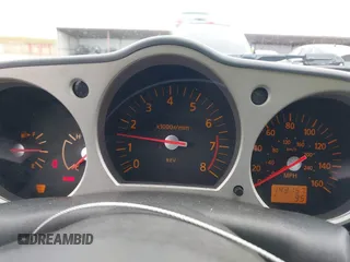 2005 Nissan 350Z Enthusiast z VIN JN1AZ34D25M605438, wystawiony jako IAAI lot #42131179 z przebiegiem 143 157 mil mil oraz . Historia ofert i sprzedaży dostępna na DreamBid. Obrazek 7.