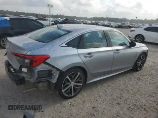 2023 Honda Civic Touring z VIN 2HGFE1F92PH323562, wystawiony jako Copart lot #54060205 z przebiegiem 20 504 mil mil oraz Czysty tytuł • Clean title. Historia ofert i sprzedaży dostępna na DreamBid. Obrazek 3.