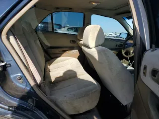 1999 Mazda Protege DX z VIN JM1BJ2227X0106522, wystawiony jako Copart lot #52423565 z przebiegiem 206 260 mil mil oraz Szkoda całkowita • Salvage title. Historia ofert i sprzedaży dostępna na DreamBid. Obrazek 10.