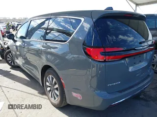2023 Chrysler Pacifica Hybrid Touring L with VIN 2C4RC1L73PR509853, listed as a IAAI auction lot 41690872 with 83,014 mi miles and . Bid and sale history available at DreamBid. Image 3.