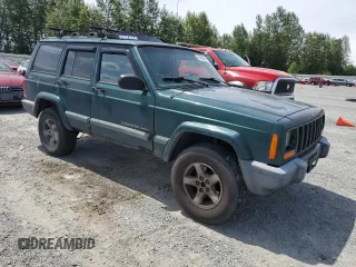 1999 Jeep Cherokee Sport with VIN 1J4FF68S2XL570795, listed as a Copart auction lot 61860585 with 320,467 mi miles and Salvage title. Bid and sale history available at DreamBid. Image 4.