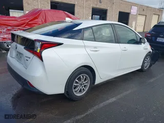 2019 Toyota Prius L Eco with VIN JTDKARFU7K3093038, listed as a IAAI auction lot 41768066 with 124,495 mi miles. Bid and sale history available at carsss.com. Image 4.