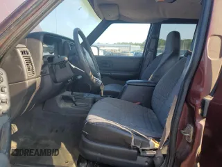 2000 Jeep Cherokee z VIN 1J4FF48S2YL135037, wystawiony jako Copart lot #66156505 z przebiegiem 72 433 mil mil oraz Szkoda całkowita • Salvage title. Historia ofert i sprzedaży dostępna na DreamBid. Obrazek 7.