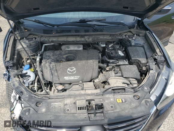 2016 Mazda CX-5 Touring с VIN JM3KE4CY8G0686101, выставлен на аукционе Copart как лот 60361215 с пробегом 126 804 миль миль и На запчасти • Non repairable. История ставок и продаж доступна на DreamBid. Изображение 11.