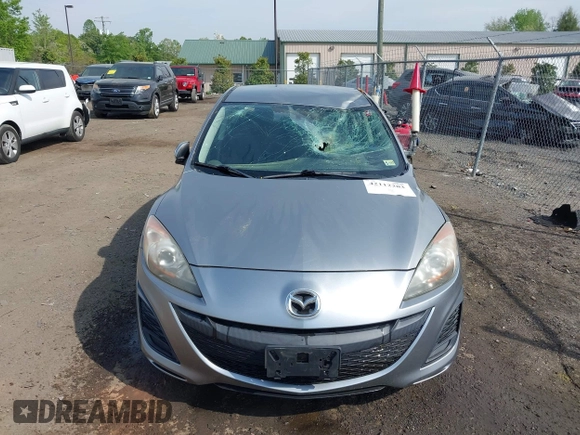 2011 Mazda Mazda3 i Touring with VIN JM1BL1VGXB1372499, listed as a IAAI auction lot 42112283 with 98,564 mi miles. Bid and sale history available at carsss.com. Image 13.