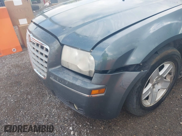 2005 Chrysler 300 with VIN 2C3AA53G55H186617, listed as a IAAI auction lot 42004943 with 230,956 mi miles. Bid and sale history available at carsss.com. Image 6.