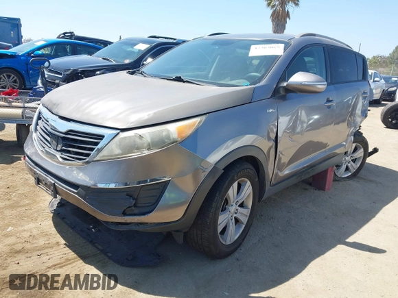 2011 Kia Sportage LX with VIN KNDPBCA20B7170217, listed as a IAAI auction lot 42303069 with 186,994 mi miles and . Bid and sale history available at DreamBid. Image 2.