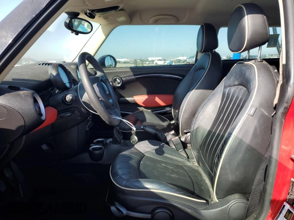 2011 MINI Hardtop with VIN WMWSU3C58BT183765, listed as a Copart auction lot 63061405 with 59,902 mi miles and Salvage title. Bid and sale history available at DreamBid. Image 7.